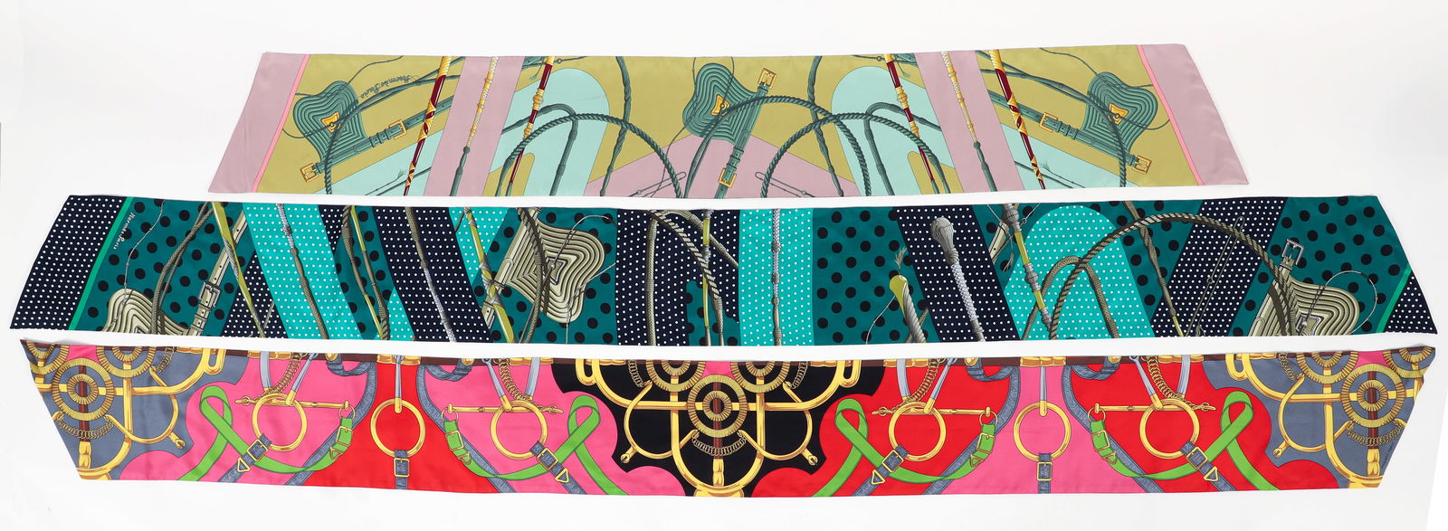 3 Hermes Twilly Cut Scarves by Julie Abadie and Henri d'Origny: 3 Hermes Max Twilly Cut Silk Scarves: includes 2 Clic Clac by Julie Abadie, blue and green scarf has original fabric label attached, blue and green scarf measures 84 x 8 inches, pink and green scarf m