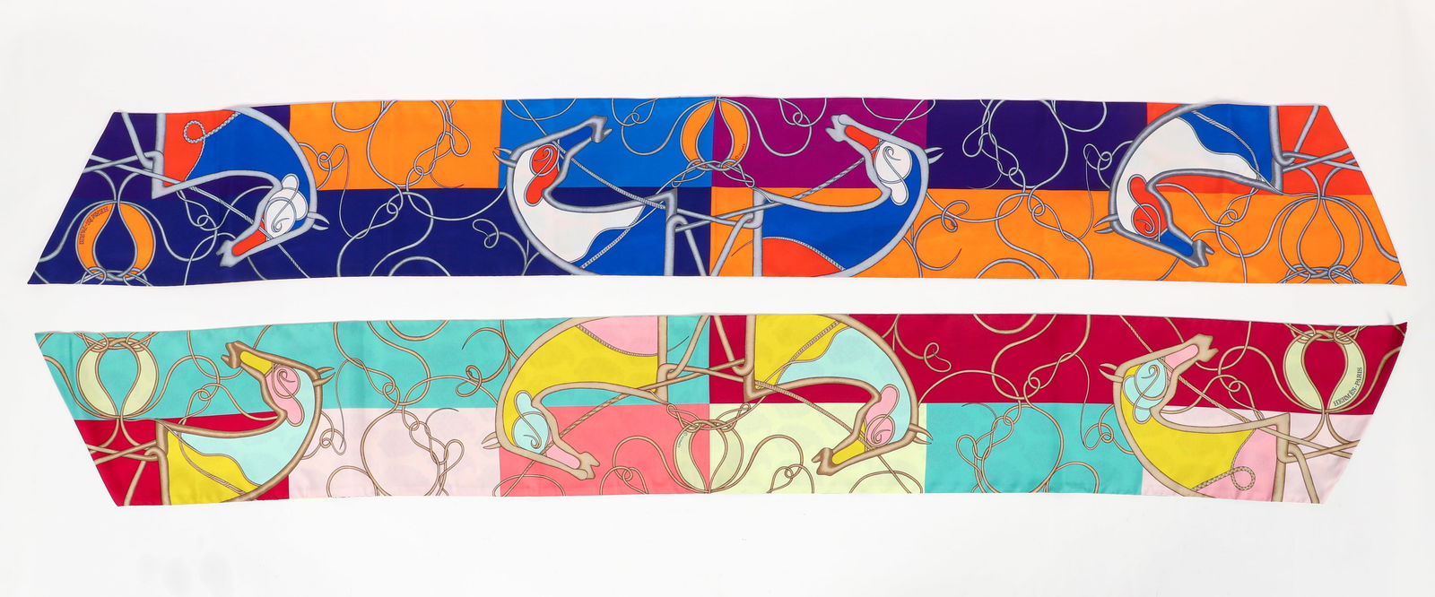 2 Hermes Coupe de Fouet au Bloc by Florence Manlik: 2 Hermes Scarves, both coup de Fouet au Bloc by Florence Manlik, max twilly cut, silk, both with Hermes copyright, made in Paris, pink and blue scarf has original fabric label attached, each 61 x 8 in