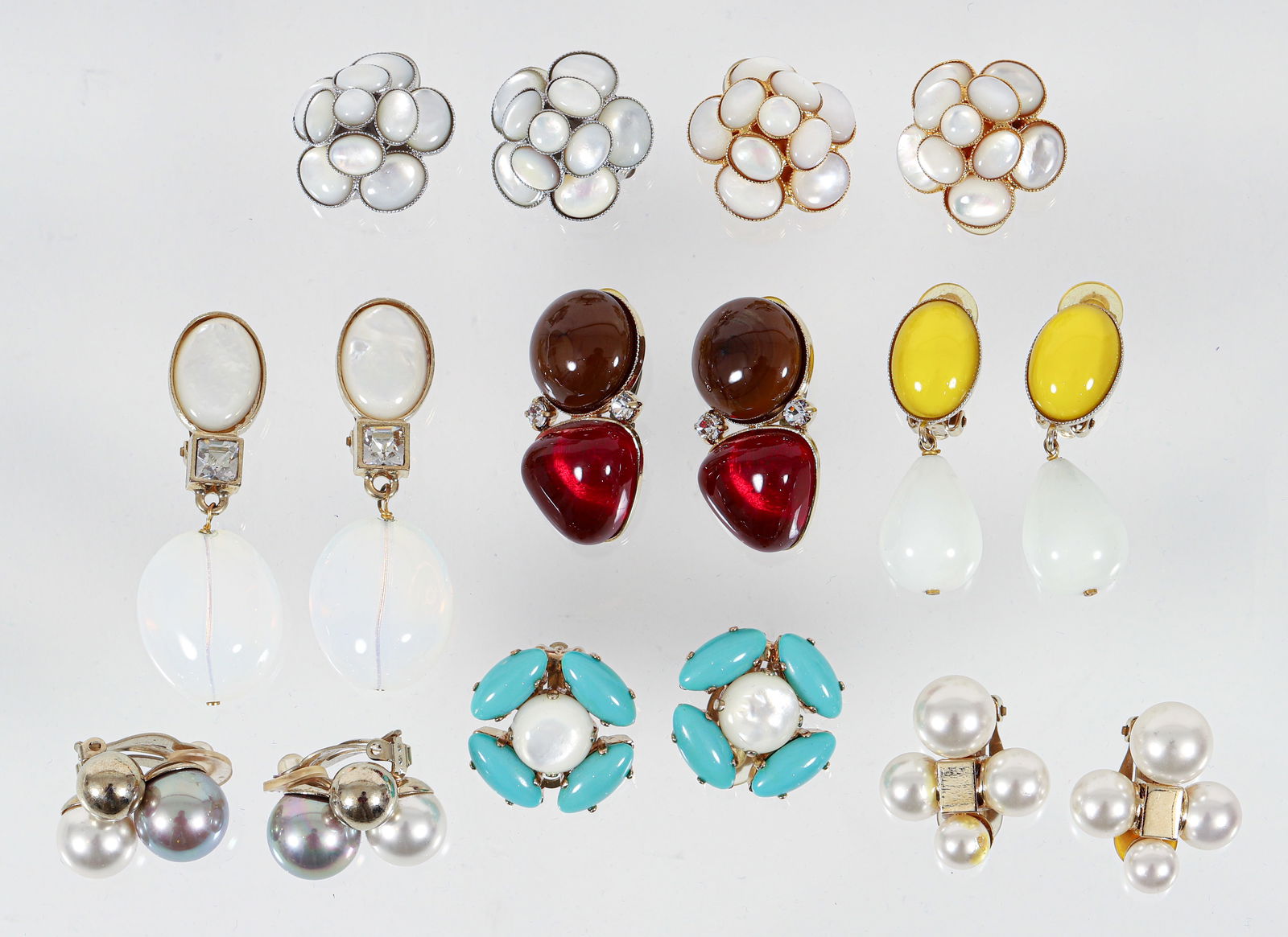 8 Pairs Philippe Ferrandis Clip Earrings: 8 Pairs of Philippe Ferrandis Clip Earrings: various styles including 3 with floral motifss, 2 with faux pearls, and 3 with costume stones, all marked "P. Ferrandis" at clip backing, ranging in size 1