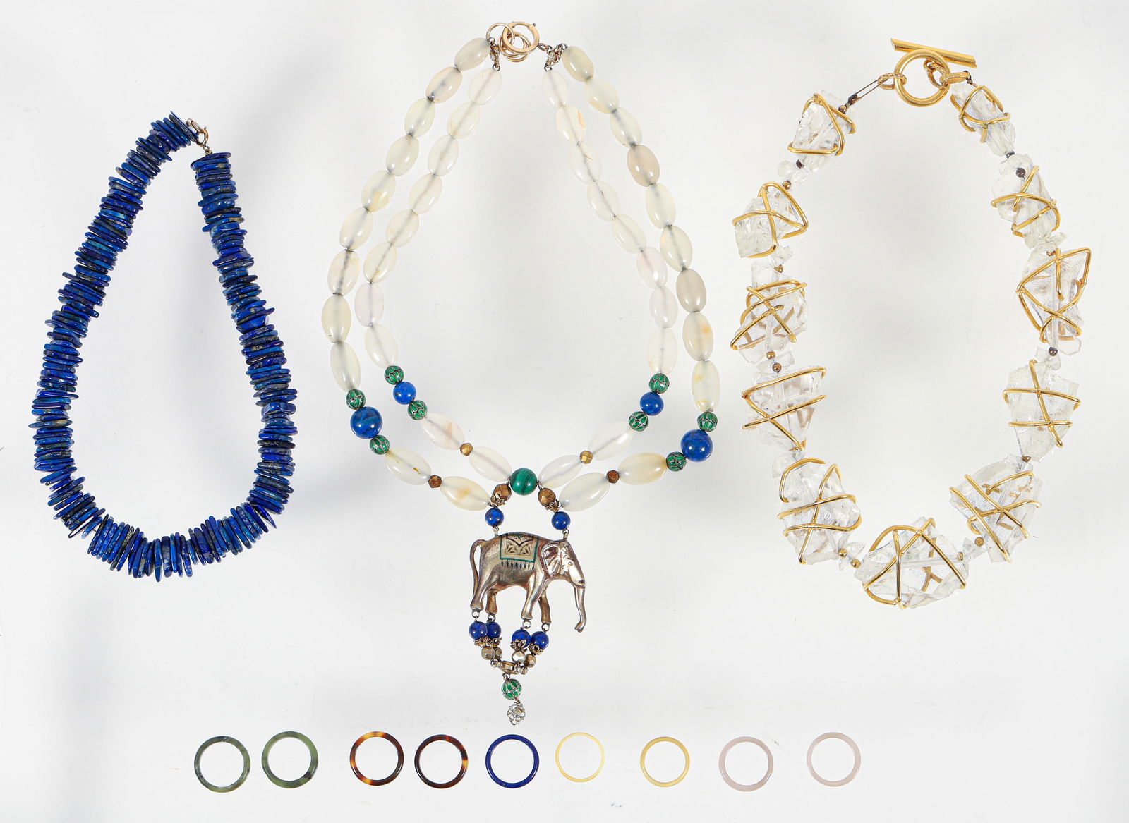 3 Chunky Necklaces with Assorted Rings: 3 Chunky Necklaces with Assorted Rings: Ruth Frank (Pittsburgh, d. 2021) double strand elephant pendant necklace, including enameled, lapis lazuli and agate beads, unmarked, pendant measures 3.5 x 2