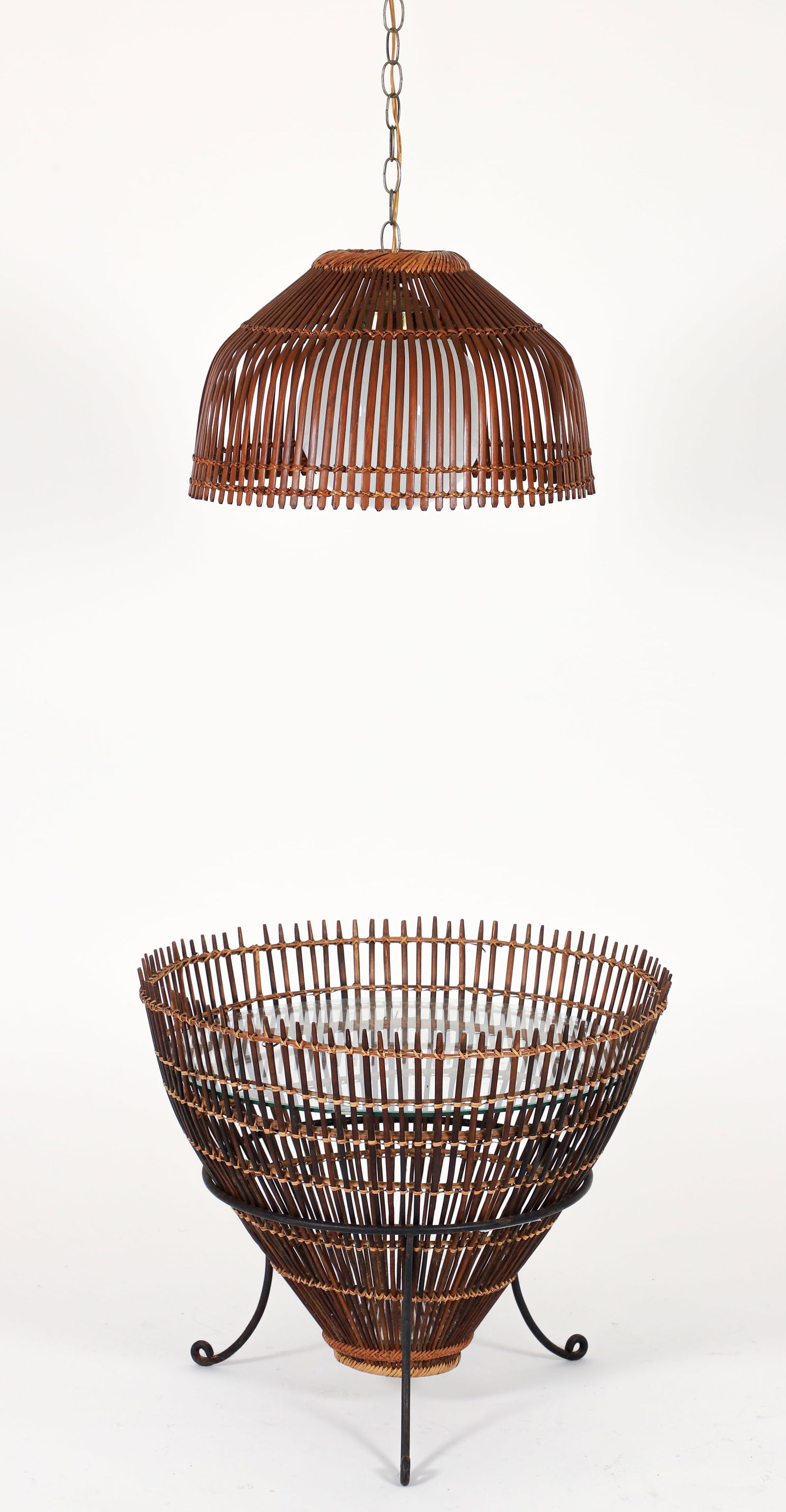 Franco Albini for Raymor Thai Fish Trap Table and Hanging Lamp: Franco Albini (Italian, 1905-1977) for Raymor Thai Fish Trap table, 1950s. Rattan conical base with two circular glass inserts, all resting on a wrought iron base. 19.5 x 23.5 inches. Together with a