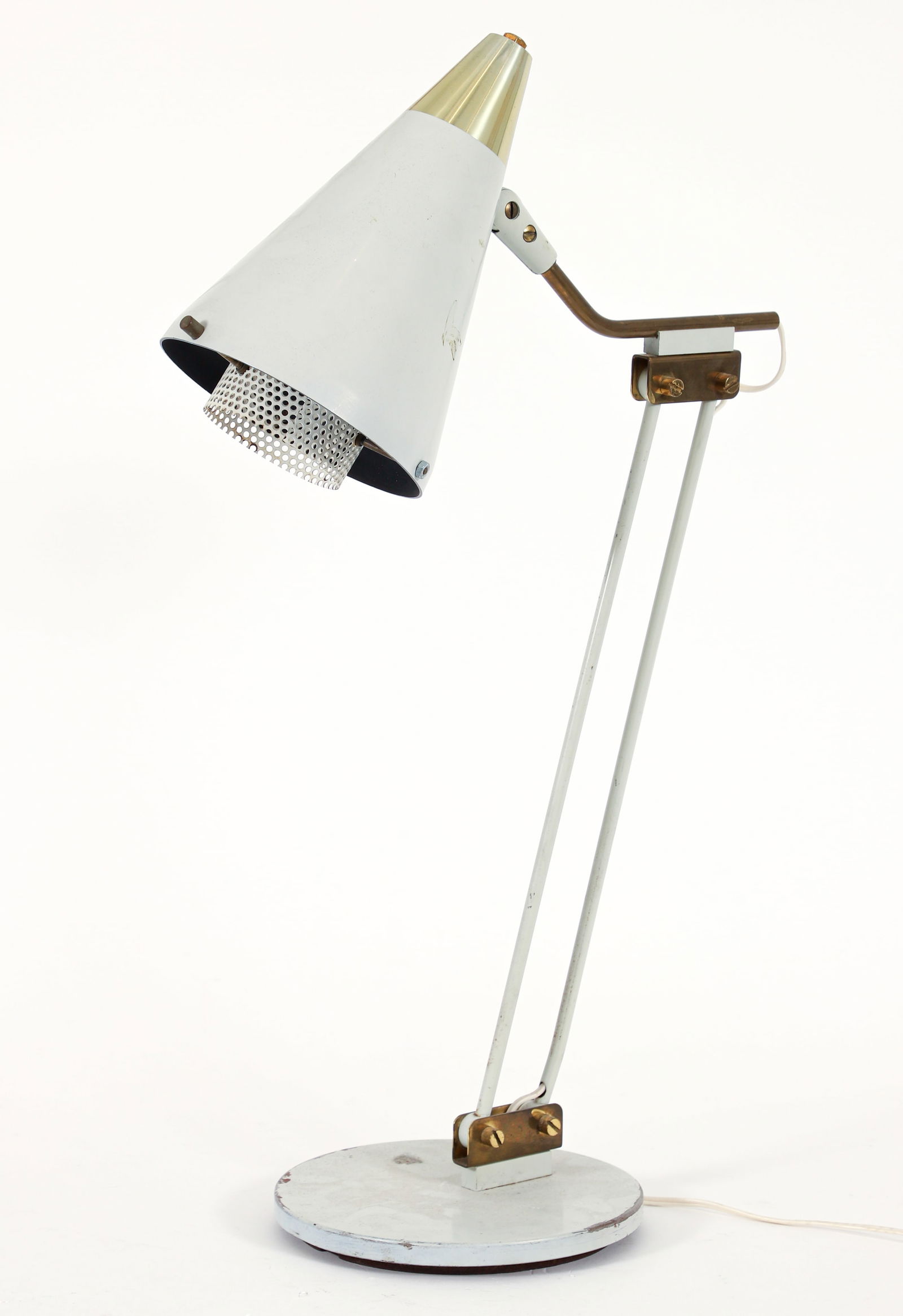 Gerald Thurston Adjustable Cone Table Lamp: Gerald Thurston adjustable cone table lamp, mid century modern. Reticulated diffuser within a white enameled cone shade, white enameled base and duel stem. With brass elements. Can be adjusted from