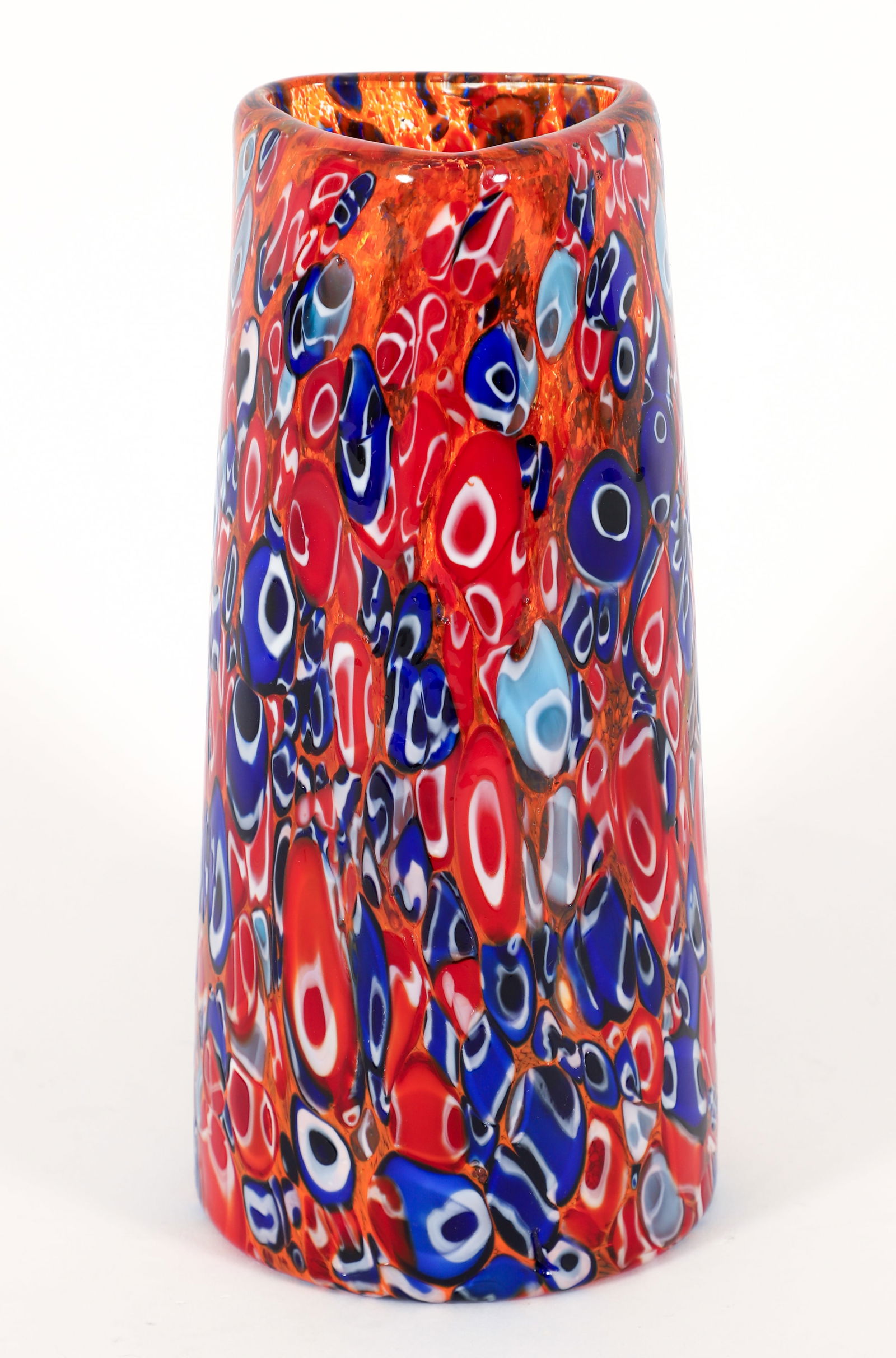 Millefiori Murano Style Glass Vase: Millefiori Murano style glass vase in orange, red, blue, grey, and white. Polished pontil. 8.25 x 3.25 inches.