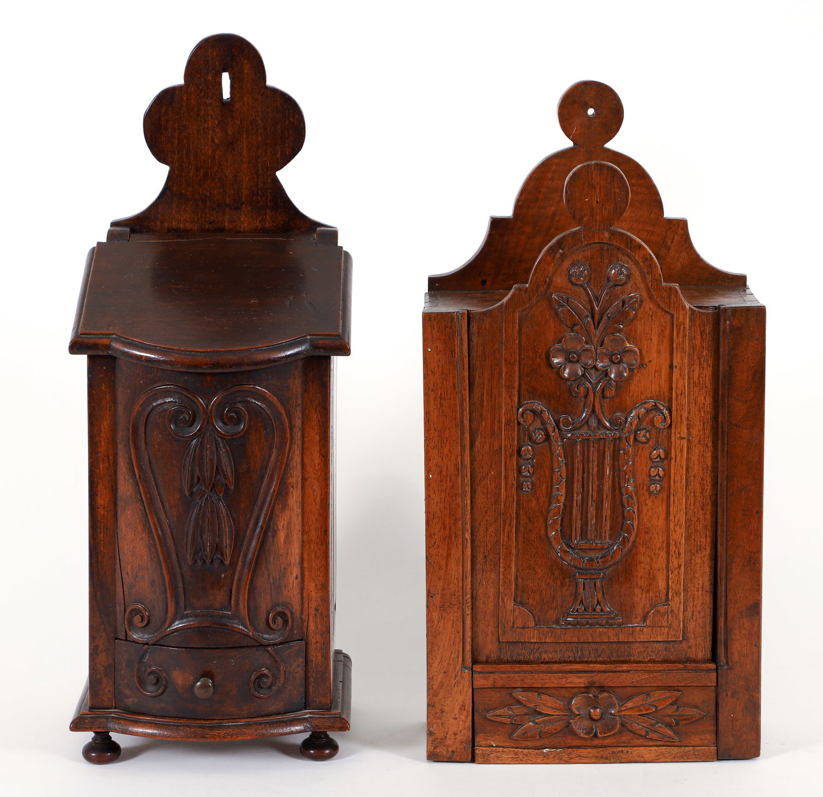 2 Antique French Wall Mounted Letter Boxes: Antique French wood letter Box, with a carved floral with Lyre Vase inside of a reserve. 16.75 x 9 x 4 inches, and Letter box with slant front lid and lower drawer, carved relief decorations and ball