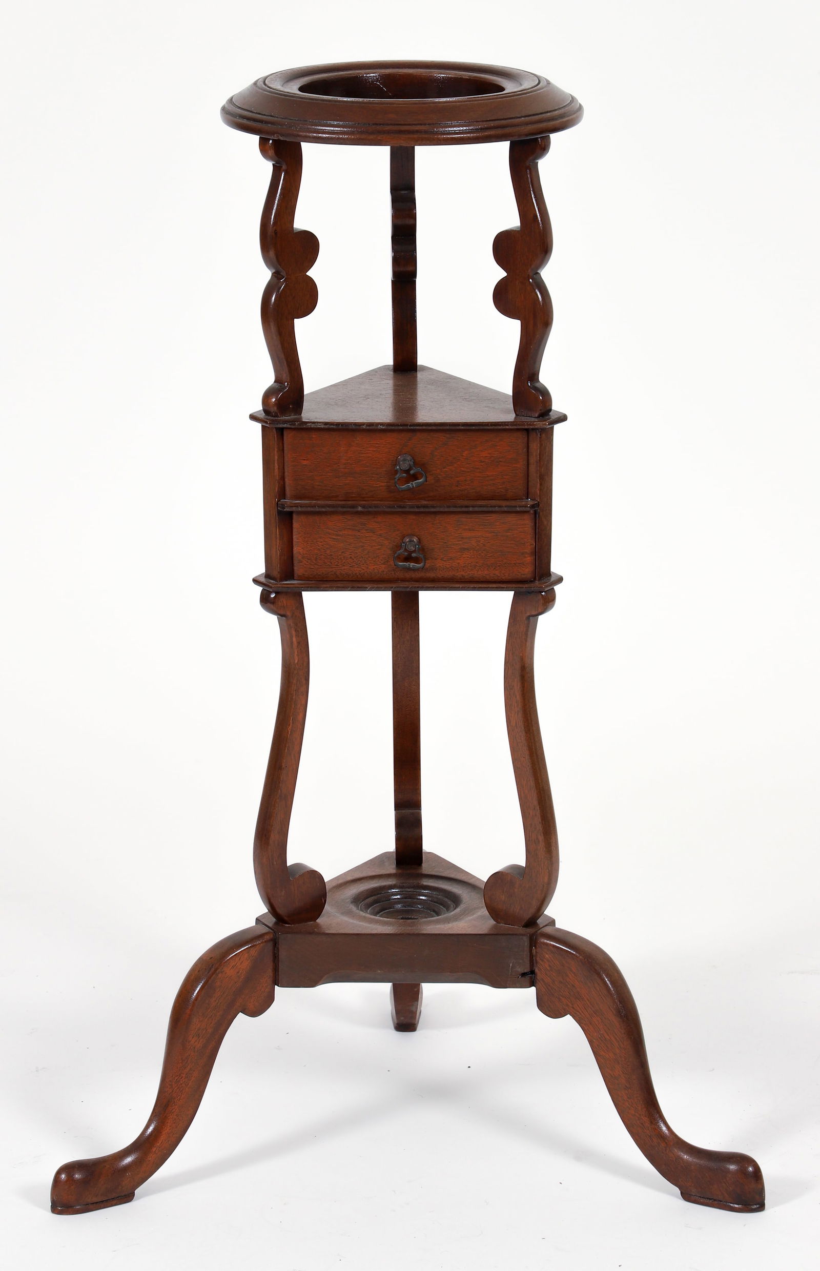 Queen Anne Style Wash Basin/Wig Stand: Queen Anne style triangular wash basin/wig stand. With two small center drawers, an open upper ring designed to hold a basin, and a lower shelf for a powder vessel. The piece is supported by a tripod
