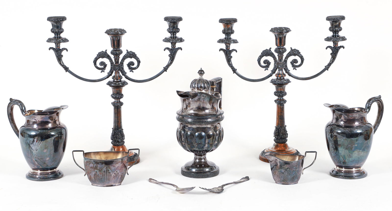 Collection of 9 Silverplate Pieces: Collection of 9 silverplate pieces. Includes: Pair of William A. Rogers water pitchers, double handled open waste bowl, creamer, William A. Rogers serving fork, Rogers and Brothers serving spoon, one