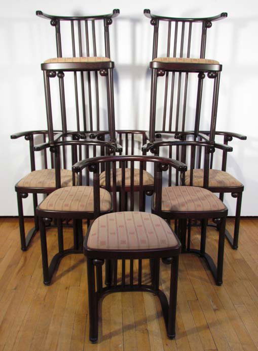 Set of 8 Hoffman/Fledermaus Style Dining Chairs: Artist: After Josef Hoffman Title: 8 Fledermaus Style Dining Chairs w/Frank Lloyd Wright style fabric on seats Medium: ebonized wood Dimensions: 30 x 19.5 x 18 inches Provenance: The Estate of Margar