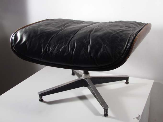 Eames Rosewood Ottoman Model 671 Design: Artist: Eames, Designed by Charles and Ray Eames Title: Leather Upholstered Rosewood Ottoman Model 671 Medium: rosewood plywood, leather, enameled steel, aluminum, enameled aluminum, down fill Dimensi
