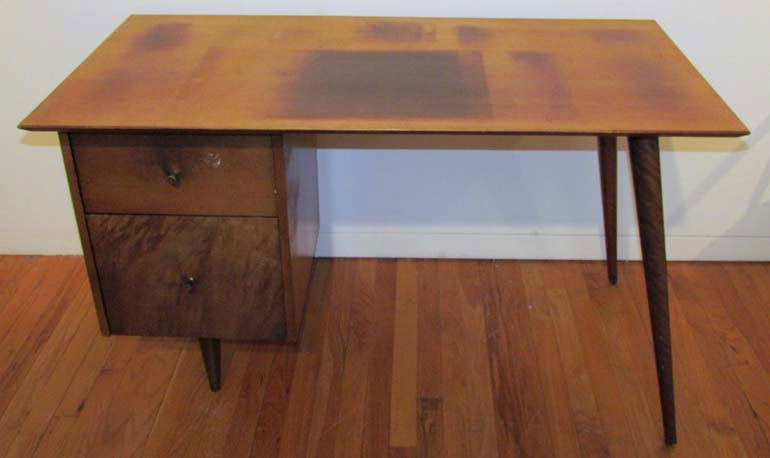 Paul McCobb 2 drawer kneehole desk: Artist: McCobb, Paul ( American, 1017-1969 ) Title: Paul McCobb for the Planner Group mid century kneehole desk with 2 drawers and tapered peg legs Date: mid 20th century Medium: wood, brass pulls Dim