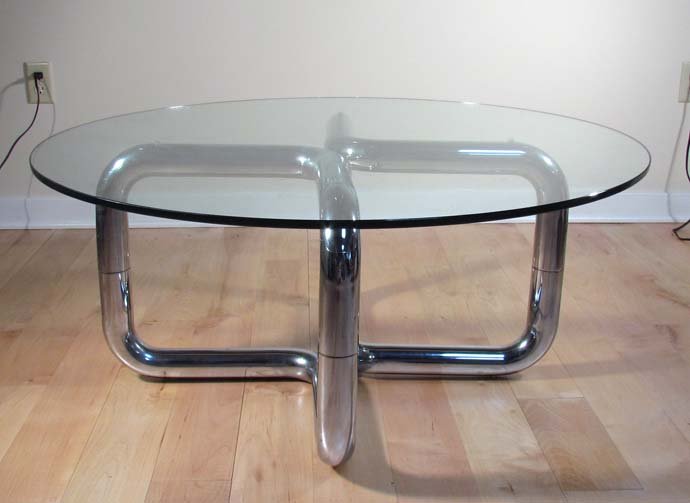 Modern Tubular Chrome Coffee Table: Title: Modern Tubular Chrome Coffee Table Medium: chrome, glass Dimensions: 18 x 42 x 42 inches Provenance: The Estate of Donna Hollen Bolmgren