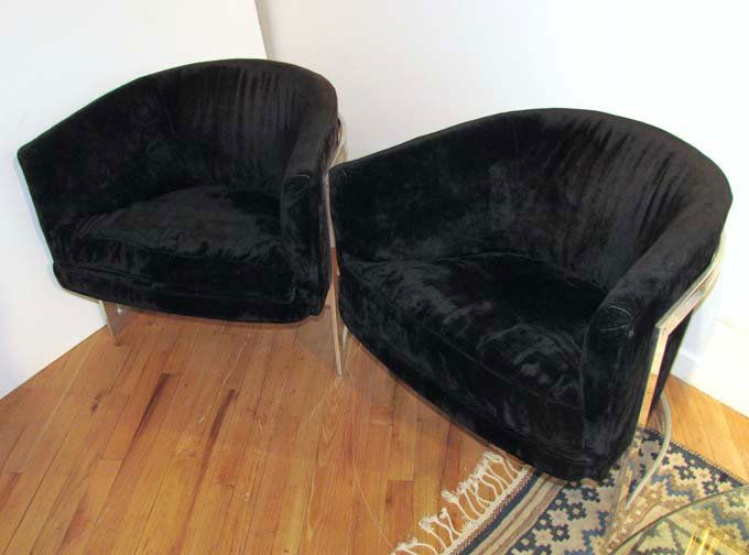 Pair Milo Baughman for John Stuart Lounge Chairs: Baughman, Milo for John Stuart Lounge Chairs, pair, barrel-shaped black fabric upholstered seats rest in solid chromed steel frames upholstered seats rest in solid chromed steel frames 24 x 28.25 x 24