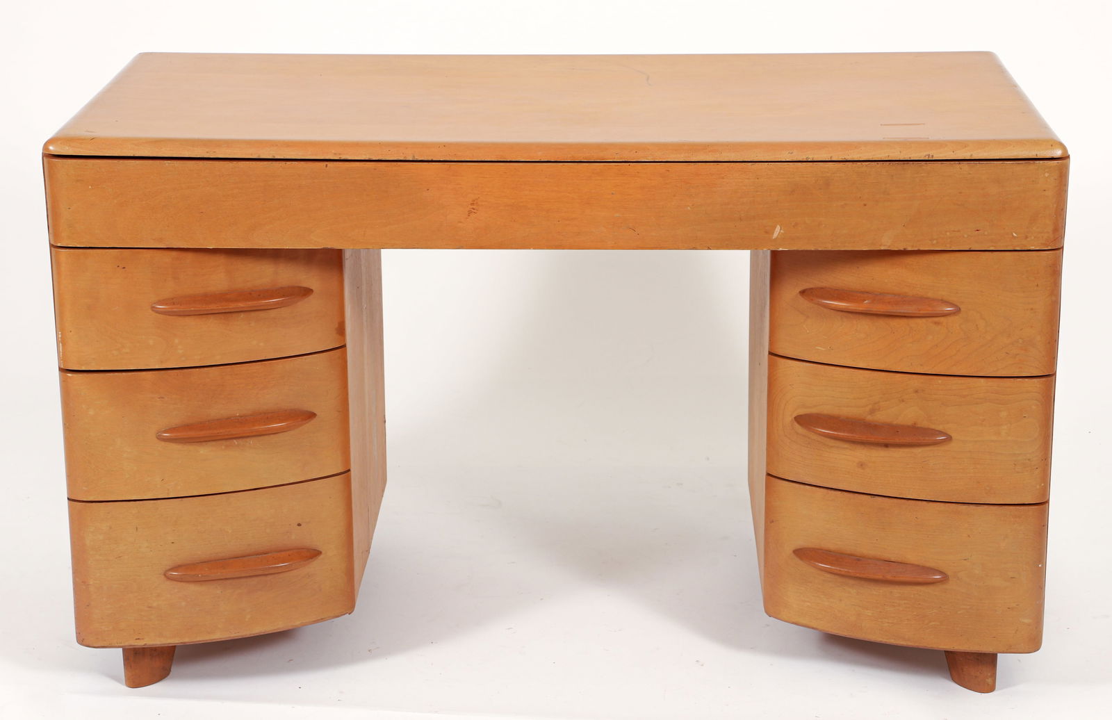 Heywood-Wakefield Kneehole Desk late 1940s: Count Alexis de Sakhnoffsky (Russian/American, 1901-1964) for Heywood-Wakefield kneehole desk in yellow birch, USA, post 1949. One long drawer over three at right and two at left. Heywood-Wakefield