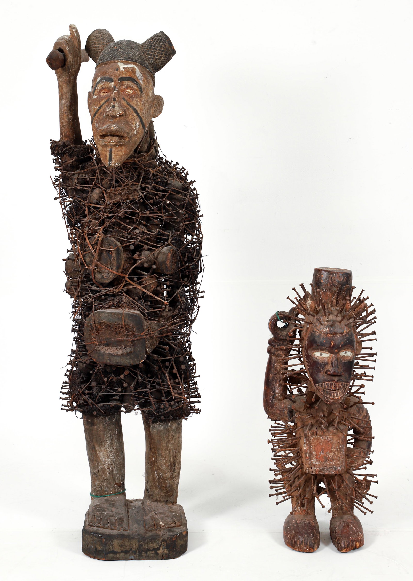 2 Kongo Nkisi N'Kondi Power Figures: 2 nkisi n'kondi power figures with nails, Kongo peoples (or after), Democratic Republic of the Congo. Large carved wood figure with loofa and other materials, wrapped with rattan, 8 compartments,