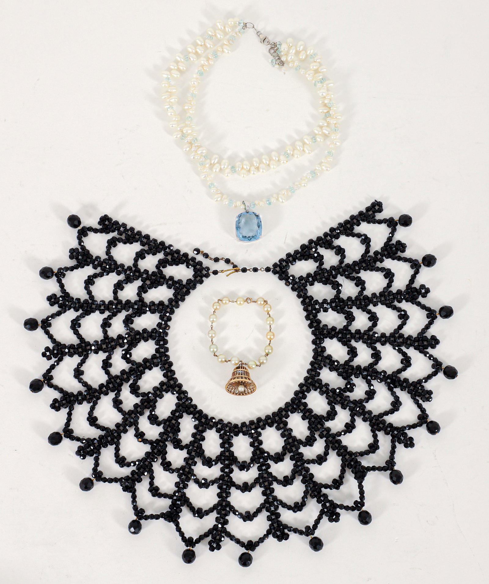3pc Jewelry Group including Pearl Necklace with Aquamarine: Double Strand Freshwater Pearl Necklace and Aquamarine. Central aquamarine face approximately 1.0 x 0.8 inches, unmarked, chain 30 inches long; TOGETHER WITH Black Glass Victorian Style Collar Necklac