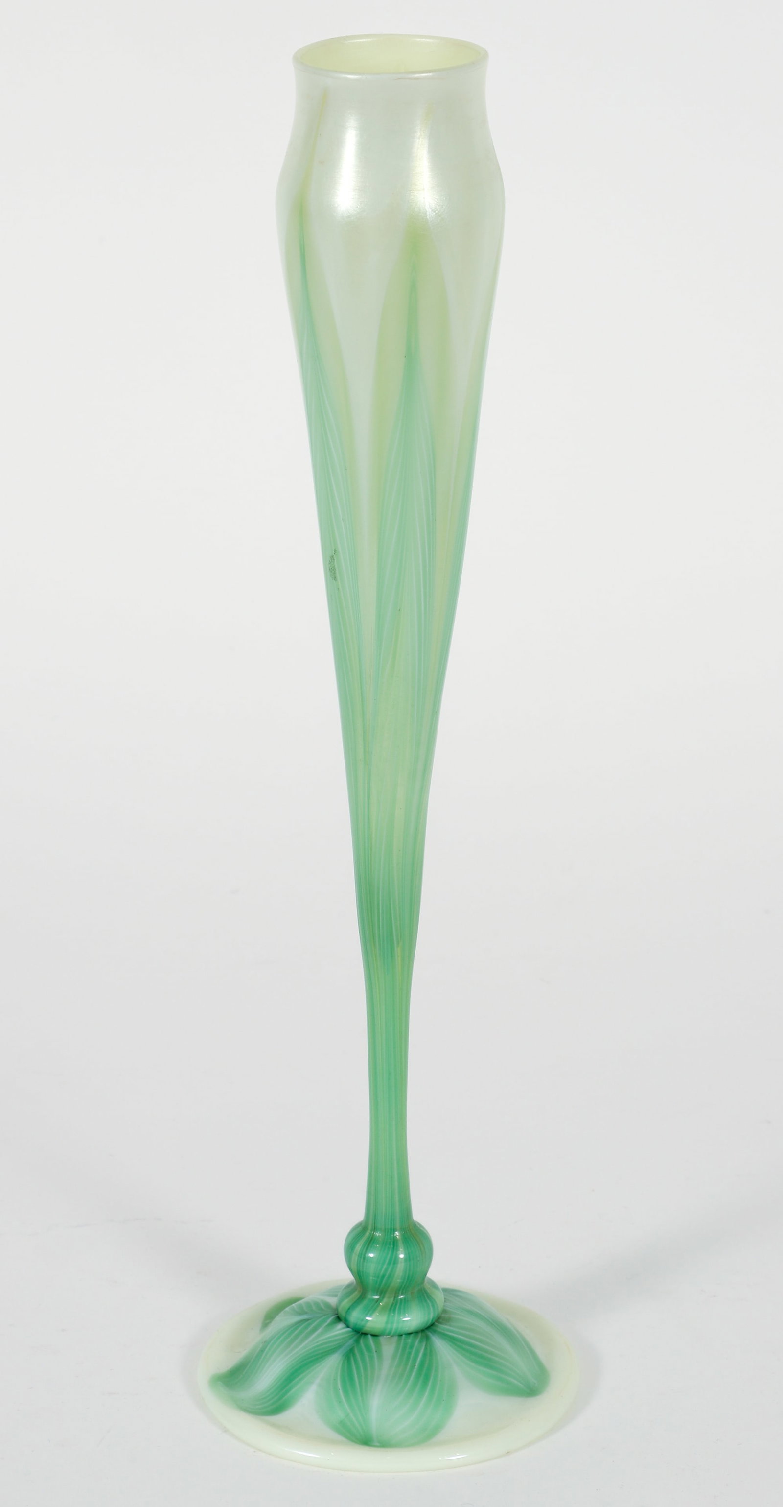 Louis Comfort Tiffany Floriform Pulled Feather Vase: Louis Comfort Tiffany floriform pulled feather vase. Unpolished pontil at underside with round paper label. 15.25 x 4.25 inches.