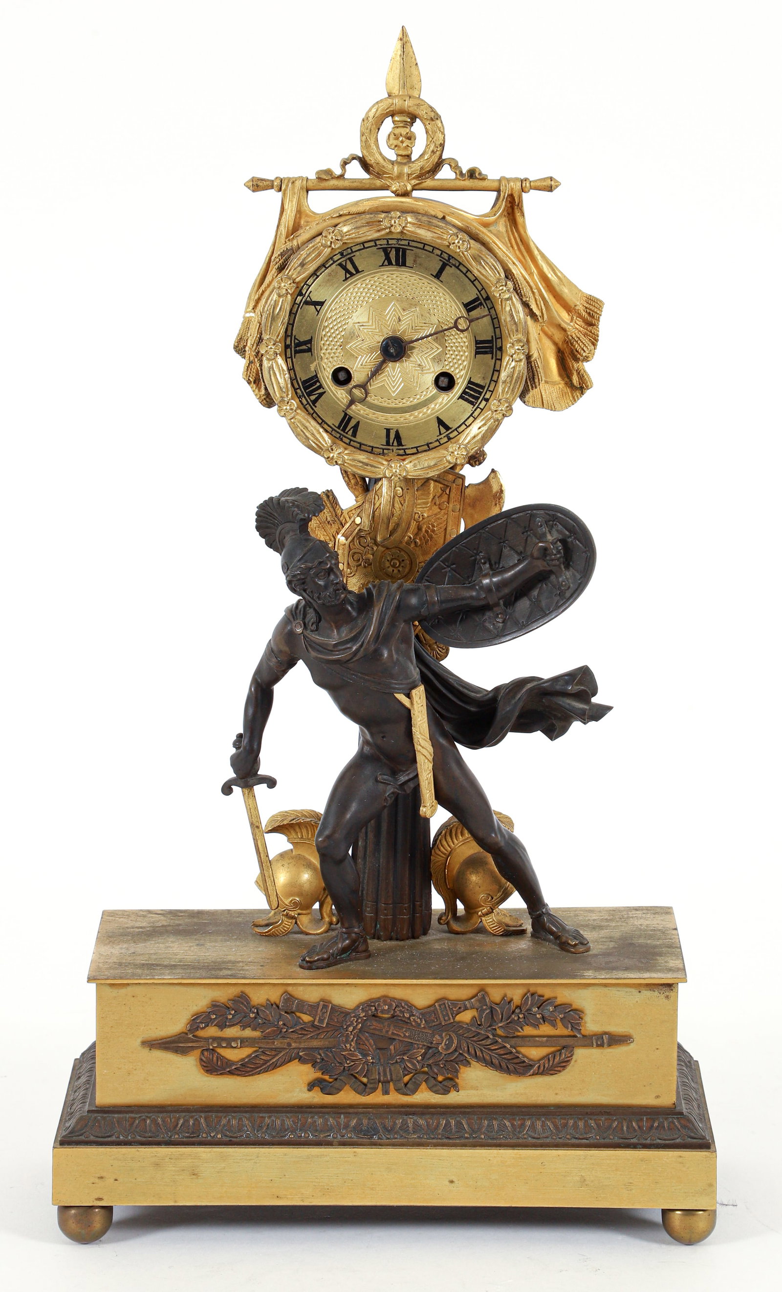 French Mantel Clock Vincenti et Cie Movement: Finely cast mantel clock, French, 19th century. Vincenti et Cie movement. Gilt bronze elements. Features a figure of Titus Tatius, king of the Sabines. Column supporting weaponry, flanked by helmets. 