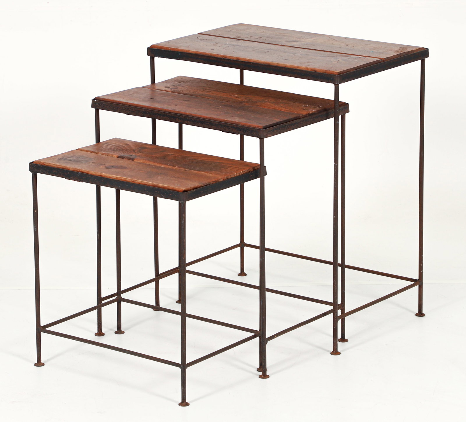 Set of 3 Iron and Pine Nesting Tables: Set of 3 iron and pine nesting tables. Wrought iron bases with pine insets. Apparently unmarked. The largest is 24.25 x 20.75 x 13.25 inches.