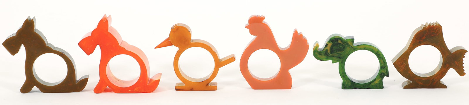 Collection of 16 Bakelite Animal-form Napkin Rings: Collection of 16 20th century Bakelite animal-form napkin rings. Various colors and sizes, includes Scotty dogs, chickens, elephants, and chicks. Ranging in size from to 2 to 3 inches.