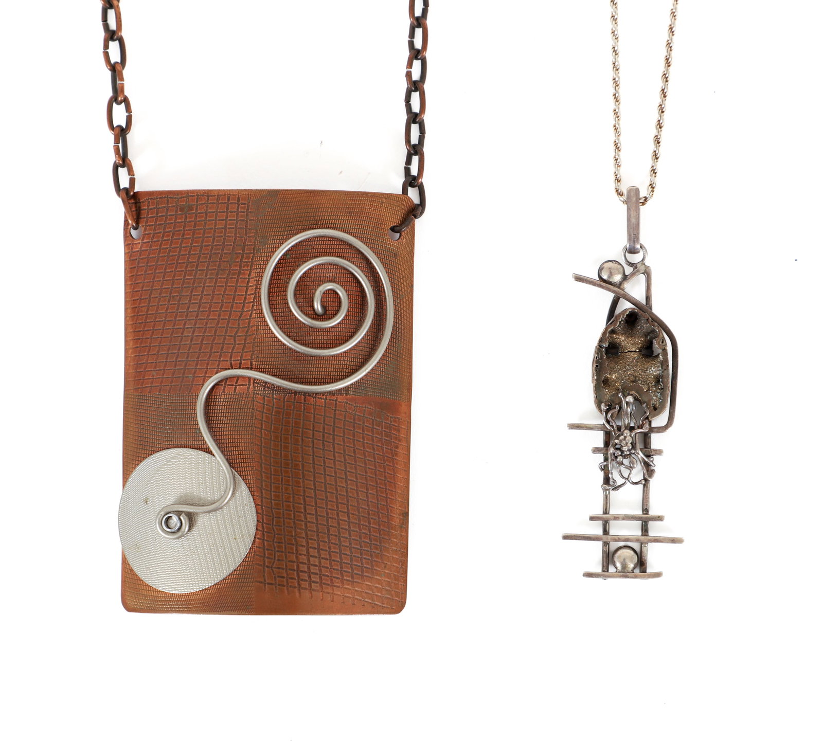 2 Modernist Necklaces: Modernist copper pendant necklace together with a modernist silver rope chain necklace with a pendant borrowing some design elements from Claire Falkenstein sculptures. Apparently unmarked. Copper pie