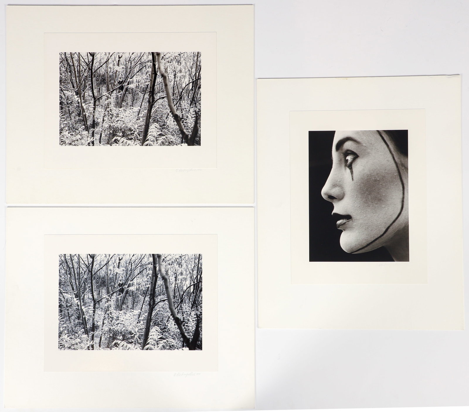 3 Abe Frajndlich 1970s gelatin silver prints signed and dated: Frajndlich, Abe (German/American, born 1946), Forest Landscape with Figure, 1973, (2), Woman with Mime Makeup, 1974, gelatin silver prints attached to archival mounts, 10.5 x 8 inches and 7.75 x 11.5 