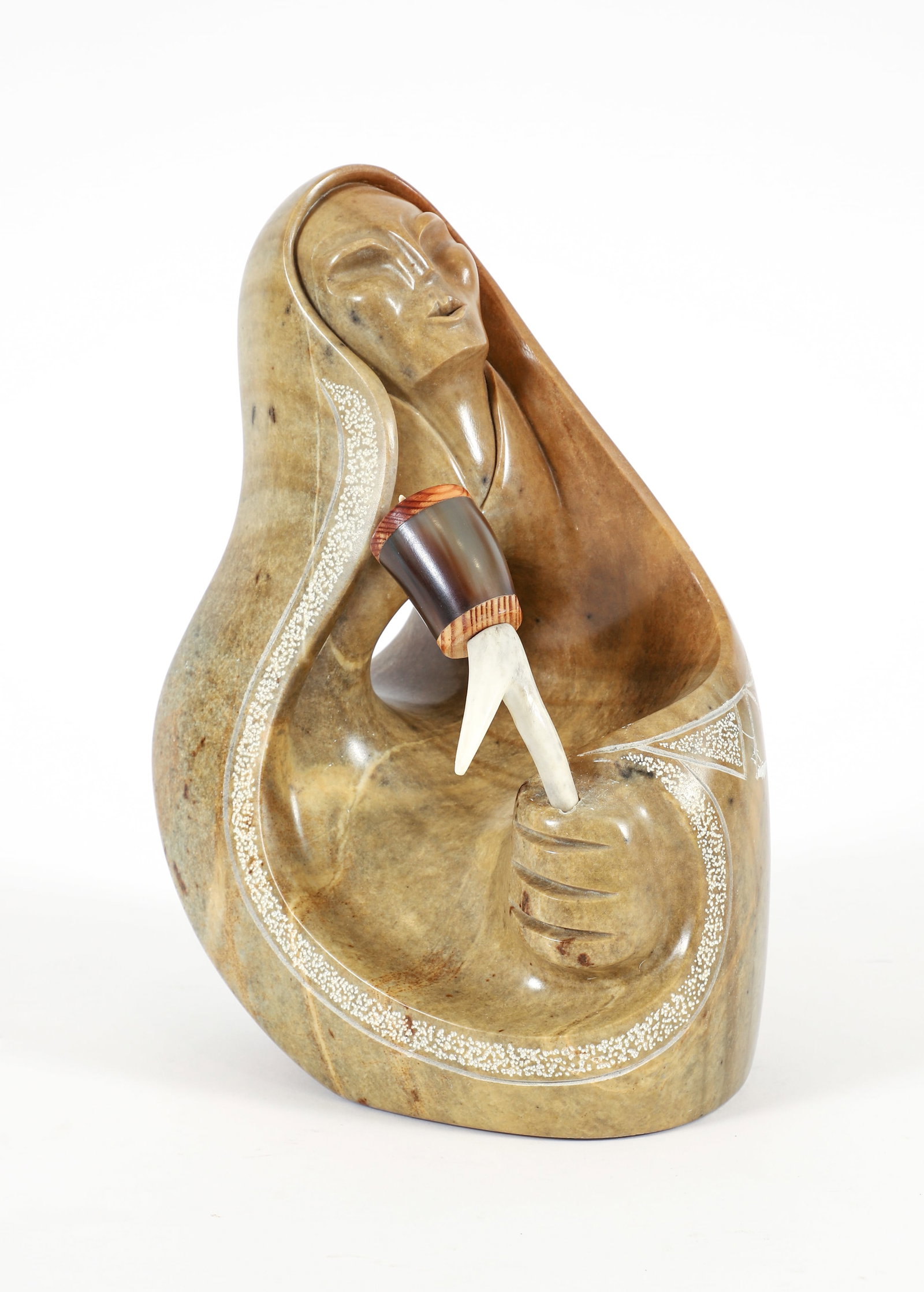 Roy Henry carved stone Seated Female Figure 2000: Henry, Roy (20th/21st Century Canadian), Seated Female Figure, 2000, carved soapstone with Ritual Rattle, 11.5 x 7 x 8 inches, signed and dated on underside.