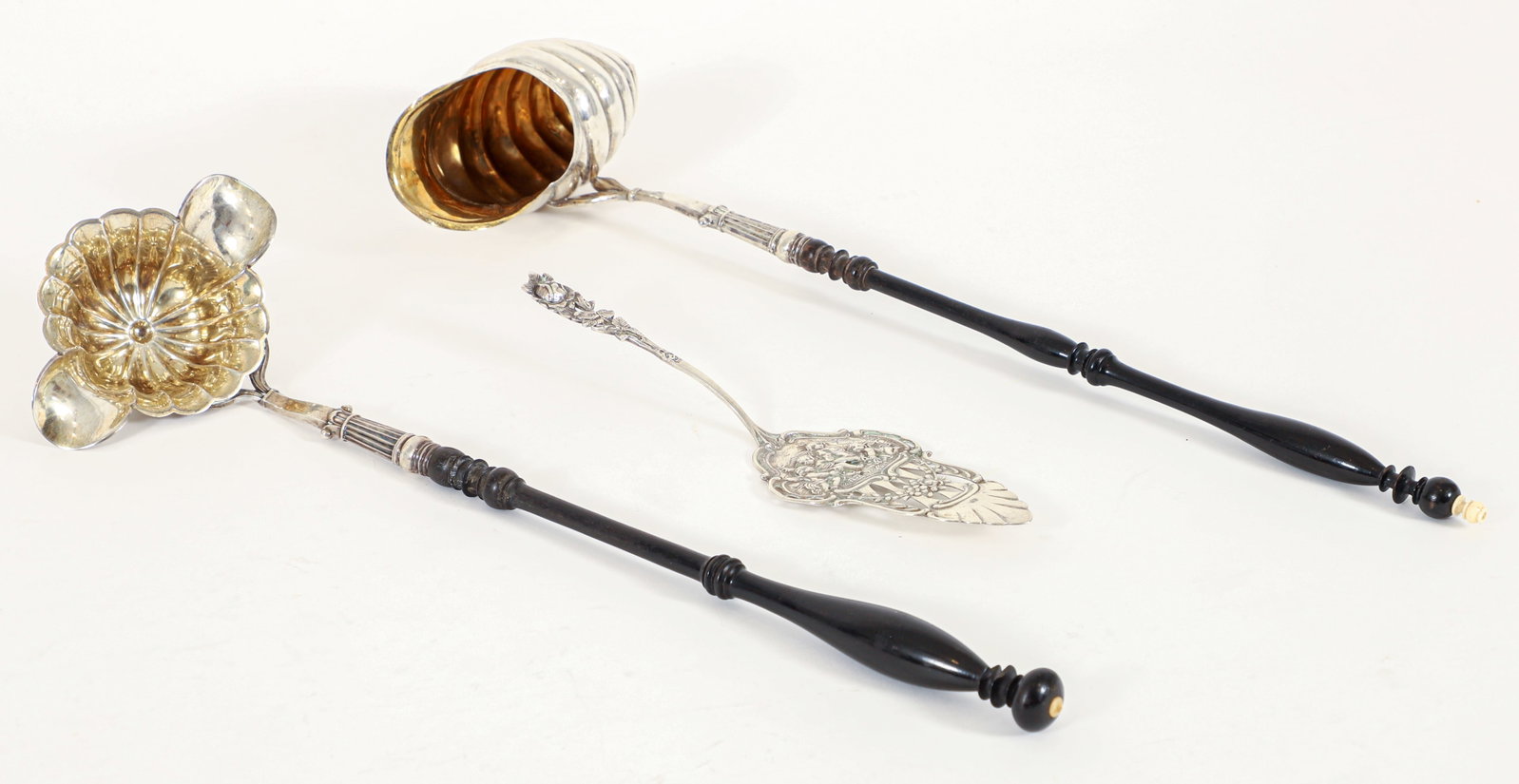 3 19th Century German 800 Silver Pieces, Ladles, Server: 3 800 silver pieces, German, 19th century. Includes: Nautilus shell-form ladle with gold wash interior and ebonized turned wood handle, early 19th century, 17.5 x 5.5 inches; Double lip fluted punch