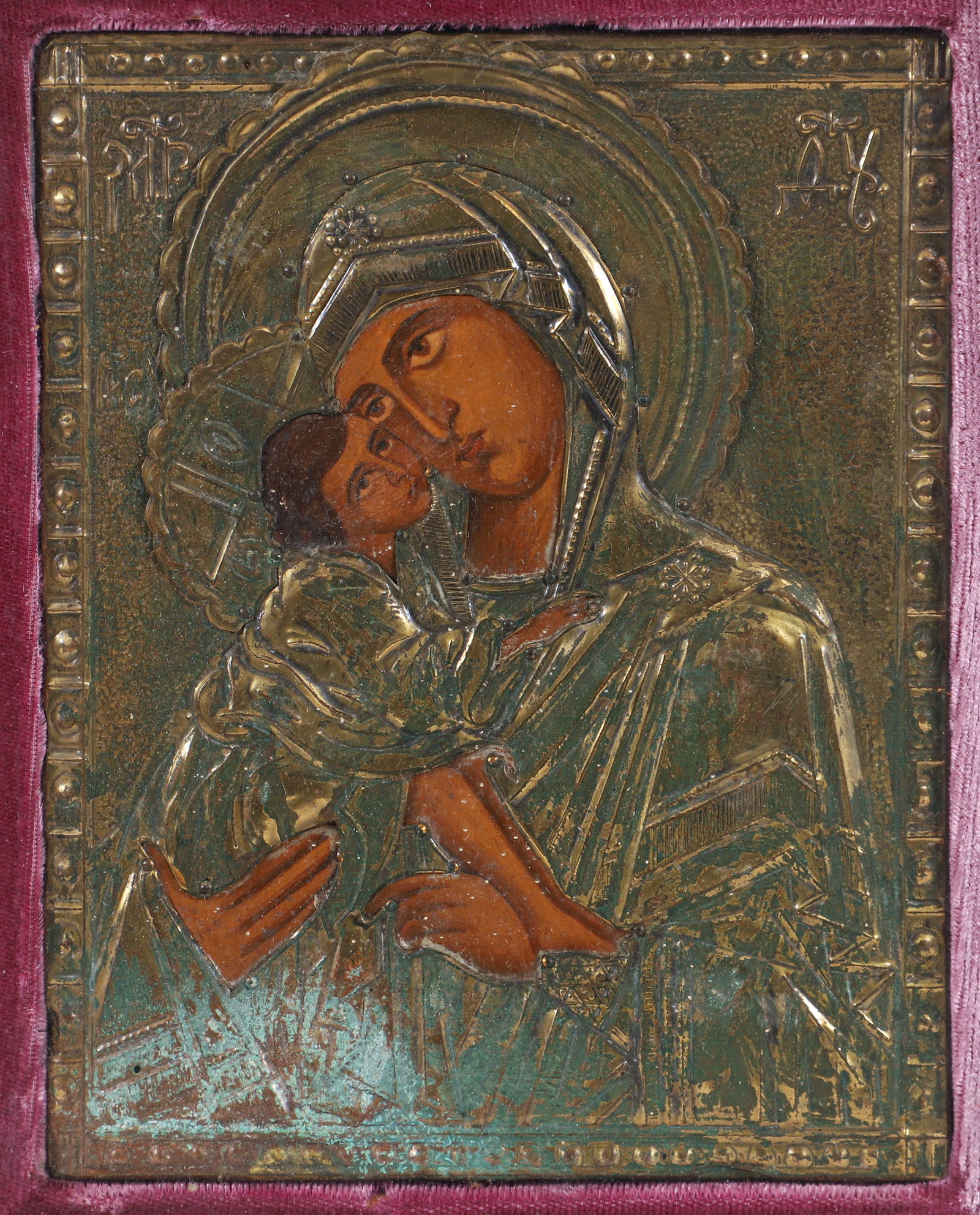 Antique Vigin of Vladimir icon, framed: Virgin of Vladimir with metal riza of unknown metal, (likely copper), well painted and likely antique, 6 x 4.75 inches, framed measuring 9.25 x 7.75 inches