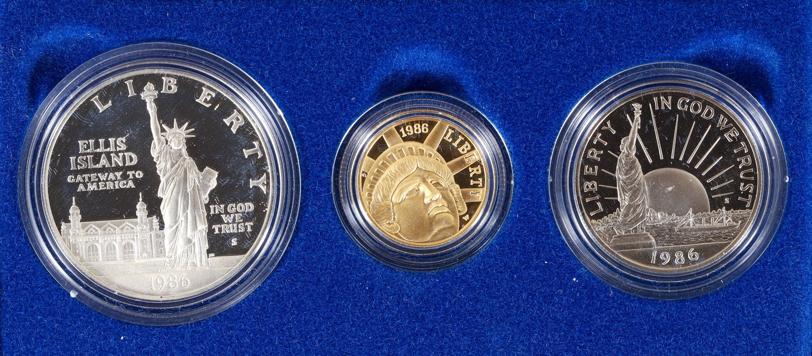1986 Statue of Liberty Gold $5 and Silver Commemorative Set: 1986 3-Coin Commemorative Statue of Liberty Proof Set with Box and COA. Non circulated with original box and paperwork included. Please Note: Payment for this lot (and all other coin, gold and silver 