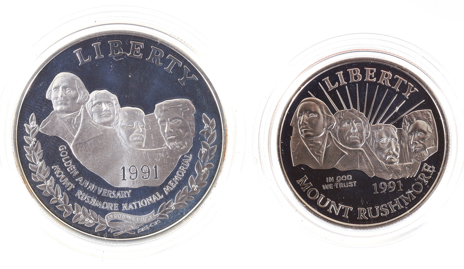 1991 Mount Rushmore Anniversary 2 Coin Proof Set: 1991-S Mount Rushmore Anniversary Commemorative 2 Coin Proof Set. Set Includes San Francisco Silver Dollar and Clad Half Dollar with Boxes and COA. Please Note: Payment for this lot (and all other coi