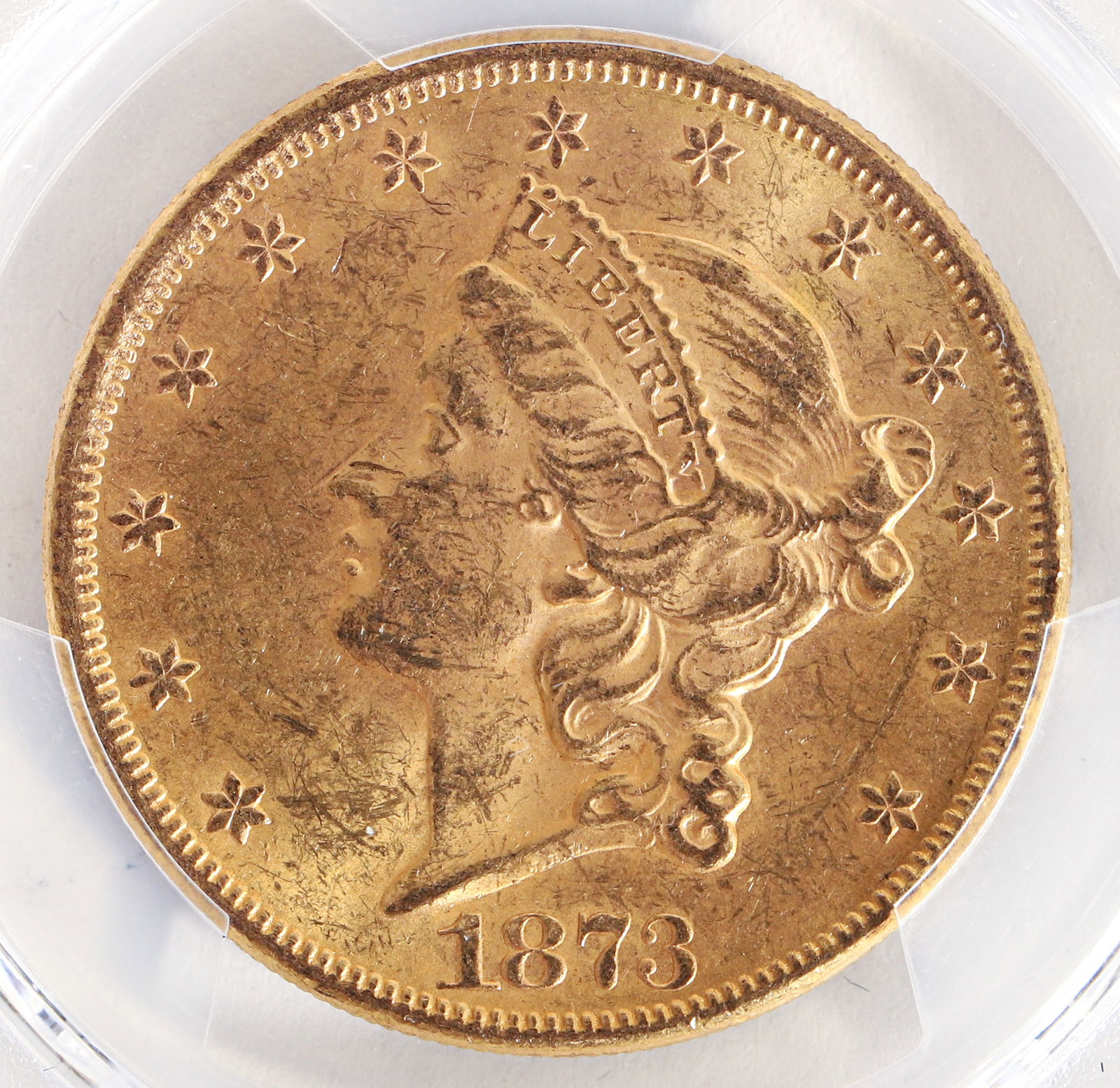 Graded 1873 Liberty Head Twenty Dollar Open 3 Gold Coin MS61: 1873 Liberty Head Double Eagle Open 3 $20 Dollar Gold Coin, PCGS graded MS61, in case and protective box. Provenance: purchased in 2020 from Rare Collectibles TV. Please Note: Payment for this lot (an