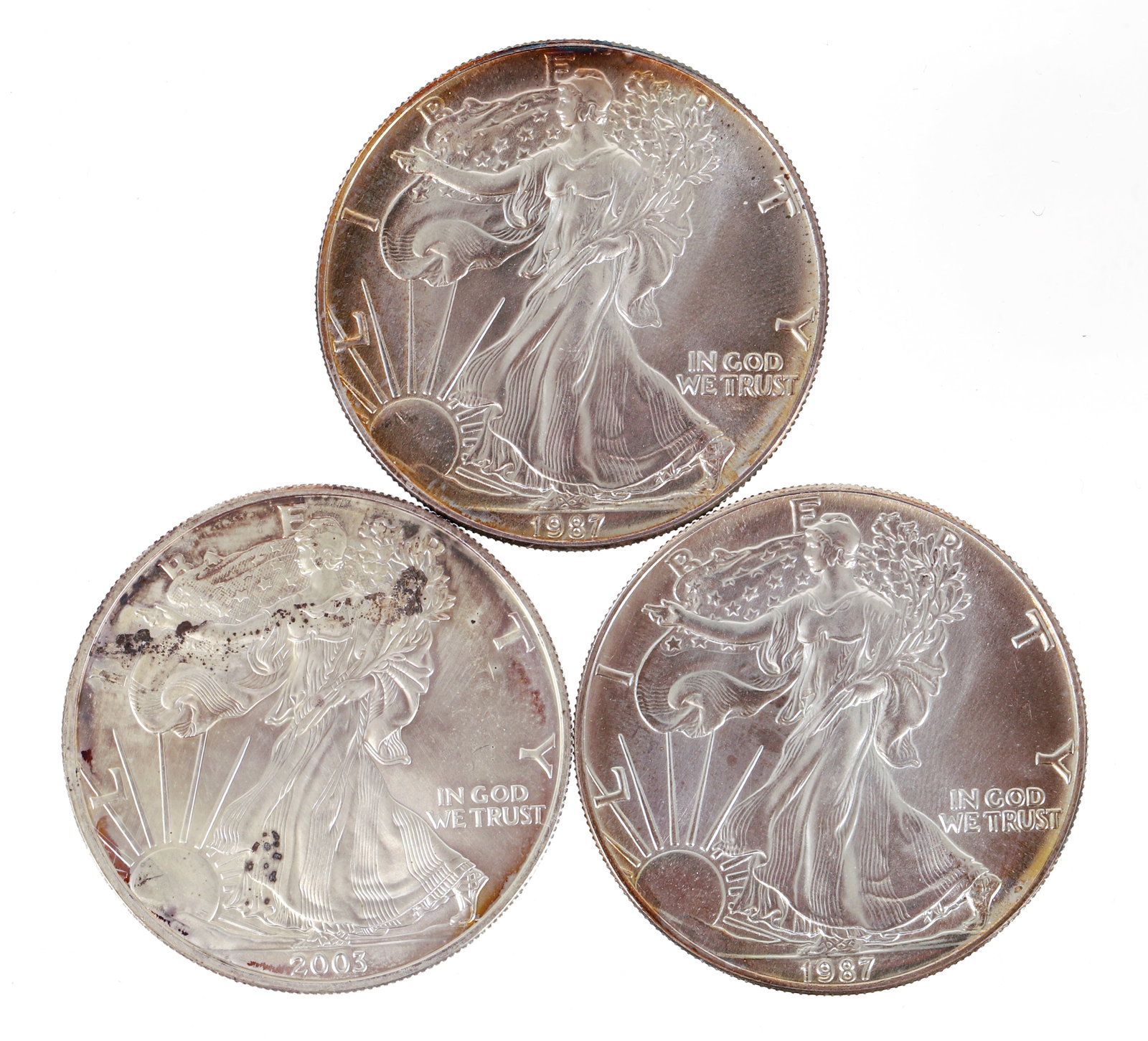 Three 1987 American Silver Eagle One Dollar Coins (1 of 2)