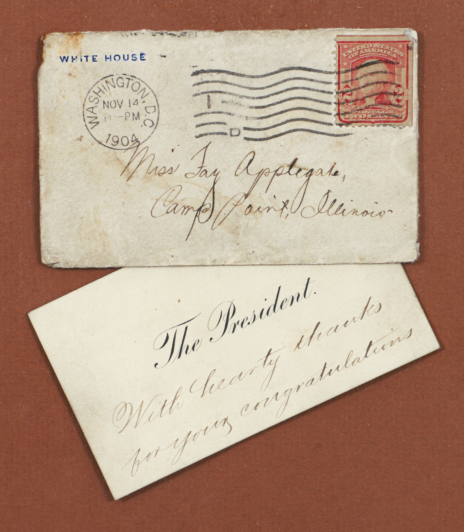 Theodore Roosevelt Handwritten Acknowledgement Card With Envelope 1904: President Theodore (Teddy) Roosevelt, handwritten acknowledgement card, mailed to Miss Fay Applegate of Camp Point, Illinois. Two line handwritten inscription, With hearty thanks for your congratulati