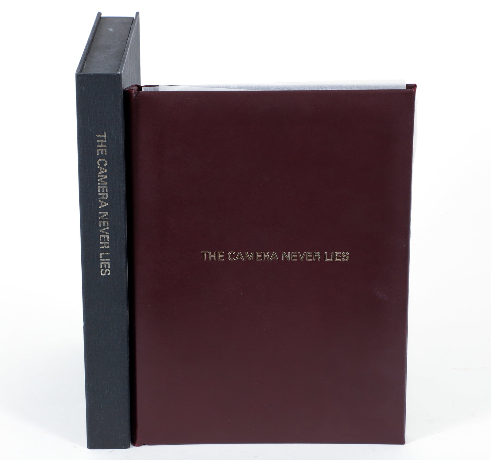 Michael Peel Camera Never Lies Circle Press Photograph Book: Michael Peel, The Camera Never Lies, number 268 of 300 copies, signed by Peel on the colophon, with laid-in photograph that's signed, numbered and titled at the bottom. Illustrated throughout, hardcov