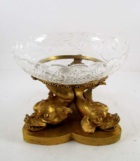 French cut glass and dore bronze center piece with dolp: Title: French cut glass and dore bronze center piece with dolphin figurine base Date: c. 1880-1900 Medium: glass and bronze Dimensions: 8 x 10 x 10 x inches