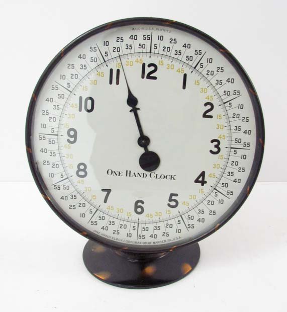 One-Handed Clock: Artist: One-Hand Clock Corporation of Warren, PA Title: One-Hand Clock Medium: clock Dimensions: 12.75 x 11 x 7 inches Provenance: Frances Debroff Collection