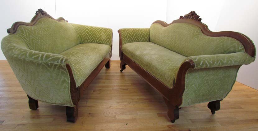 Two Victorian Settees with Lime Upholstery: Title: Two Victorian Settees with Lime Upholstery, floral wood carving, bow back one circa 1850 the other later 19th CenturyMedium: wood, upholstery Dimensions: 34 x 66 x 26 inches each, approximately