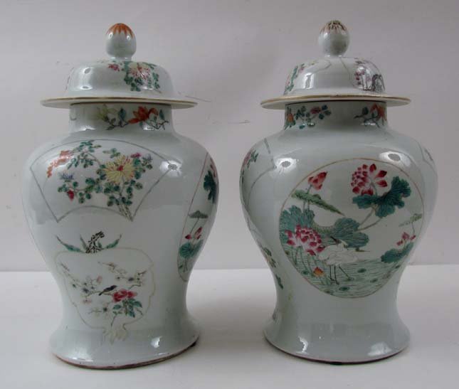 pair Famille Vert Chinese Ginger Jars: Title: a pair of Famille Rose Verte Lidded Ginger Jars with flower, bird and vase decoration Date: late 19th early 20th cen Medium: glazed porcelain Dimensions: 14.75 inches tall