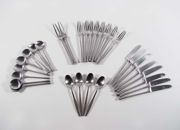 Partial Set of JETTE Flatware by Jens Quistgaard for: Artist: Jens Quistgaard for Dansk Germany Title: Partial Set of Dansk Stainless Flatware, pattern Jette, including: 8 teaspoons, 8 knives, 8 forks, 2 serving forks (two prongs), plus 4 teaspoons patte