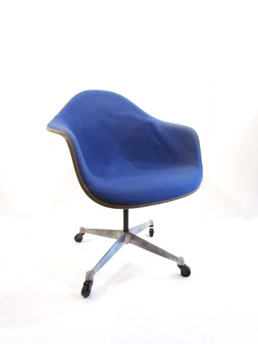 Charles Eames for Herman Miller shell arm chair with: Artist: Eames, Charles (American, 1907-1978) Title: Charles Eames for Herman Miller shell arm chair with blue fabric Medium: fiberglass shell, aluminum base, fabric Dimensions: 33 x 26 x 28 inches
