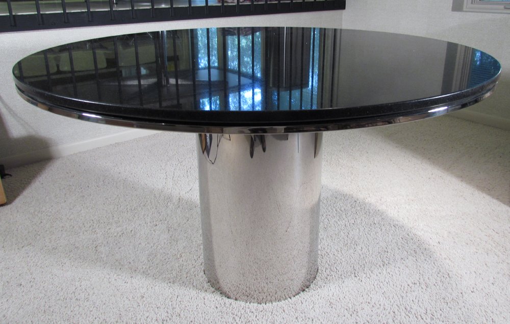 Knoll Black Marble and Chrome Drum Table: Artist: Knoll Title: Knoll Black Marble with chrome lip and Chrome Drum Table Base Dimensions: 28 x 48 x 48 inches Provenance: Dr. Charles Hohing,