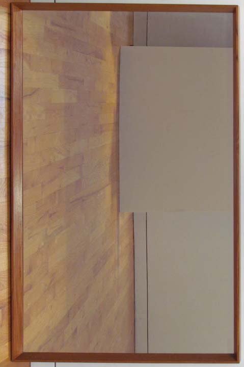 Peteresen and Hansen Danish Modern Teak Mirror: Artist: manufactured and designed by Peteresen and Hansen, Danish, 20th Century Title: Model No. 969 Teak Mirror Medium: Teak and glass Dimensions: 44.5 x 27.5 inches