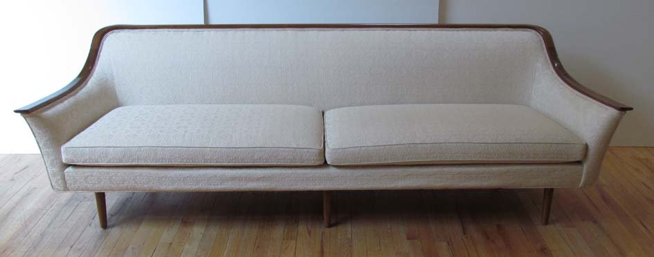 Edward Wormley for Drexel sofa: Artist: Wormley, Edward for Drexel Title: Sofa with Walnut decoration and white damask upholstery Medium: walnut, damask upholstery Dimensions: 29.75 x 92.5 x 33 inches Signature: sewn label Drexel Fu