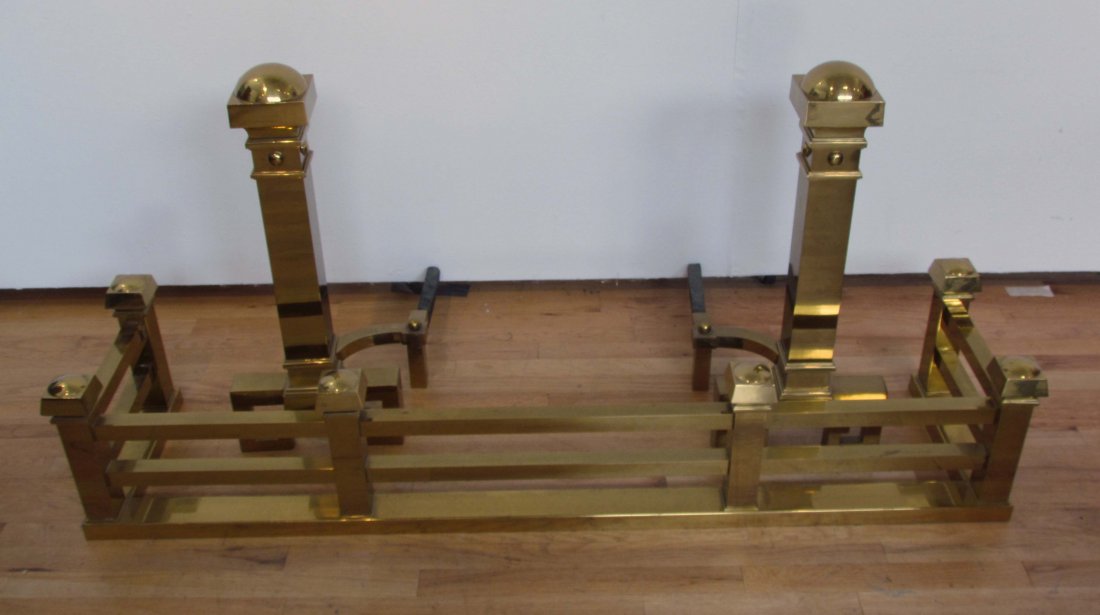 Massive Art Deco Brass Andirons and Fender: Title: Art Deco Brass Andirons and Fender, Andirons with Greek Key Bases Date: circa 1920's Medium: Brass and Iron Dimensions: Fender 12.5 x 15 x 62 inches & two Andirons 30 x 13 x 20 inches Provenanc