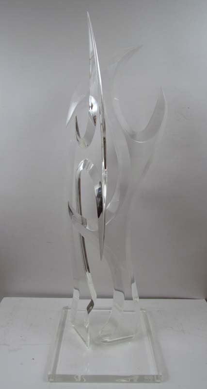 HIVO VAN TEAL CLEAR ACRYLIC ABSTRACT SCULPTURE: Van Teal, Hivo G. ( Netherlands/American, 20th C.) Skirmesh, 1986 polished and hand cut clear acrylic sculpture 38 x 12 x 12 inches incised Van Teal on top edge of the base Van Teal, Inc. Miami Fla.