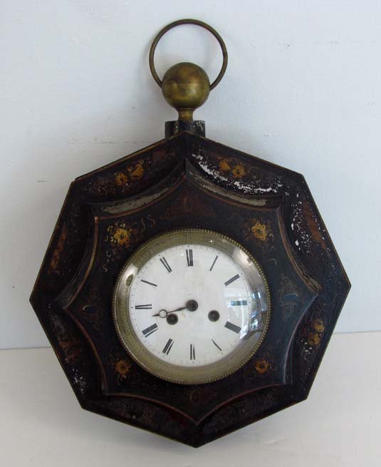 Continental Tole painted octagonal wall clock: Title: Continental Tole painted octagonal wall clock with brass knob and ring Date: circa 1840 Medium: wood and brass Dimensions: 16.5 x 13.75 x 4 inches Signature: old early 20th century label verso