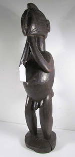 Baga, Guinea, Ebonized Wood Nimba Dancer Figure: Artist: Baga Peoples , Guinea Title: Nimba Dancer Figure Date: prior to 1949 Medium: carved and ebonized wood Dimensions: 25 inches tall Description: a beautifully carved wooden head Prov