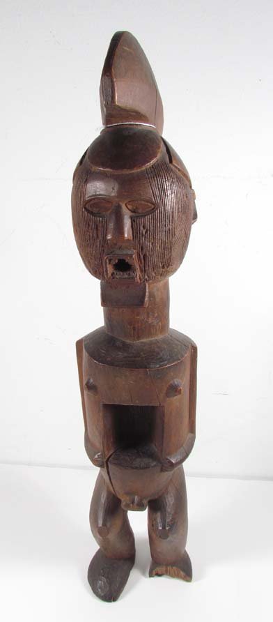 YAKA TRIBE FETISH FIGURE - ZAIRE: Artist: Yaka, Congo, Central Africa Title: Helmeted YAKA TRIBE FETISH FIGURE with intricately incised decorated facial detail Date: prior to 1949 Medium: carved wood Dimensions: 20.5 inches tall Pr