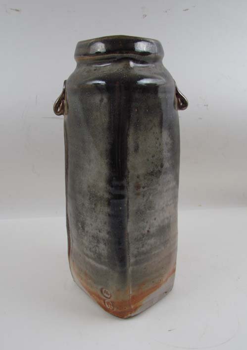 Warren MacKenzie Shino-glazed, squared Bottle Vase: Artist: MacKenzie, Warren (American born 1924 -) Title: Shino-glazed, squared Bottle Vase with side rim handles Medium: Shino-glazed, ceramic Dimensions: 14 x 5.5 x 5.5 inches Description: Warren McKe