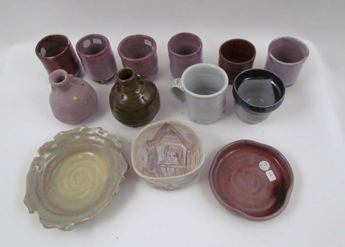 13 Pc.s Kirk Mangus ceramic ware: Artist: Mangus, Kirk (Contemporary American Ceramicist) Title: Collection of Tea Cups and Small Vases, Mug, Saucers, and Wine Stand Medium: glazed stoneware Dimensions: various sizes Provenance: Elvir