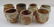 7 Jack Troy ceramic teacups and one Coffee